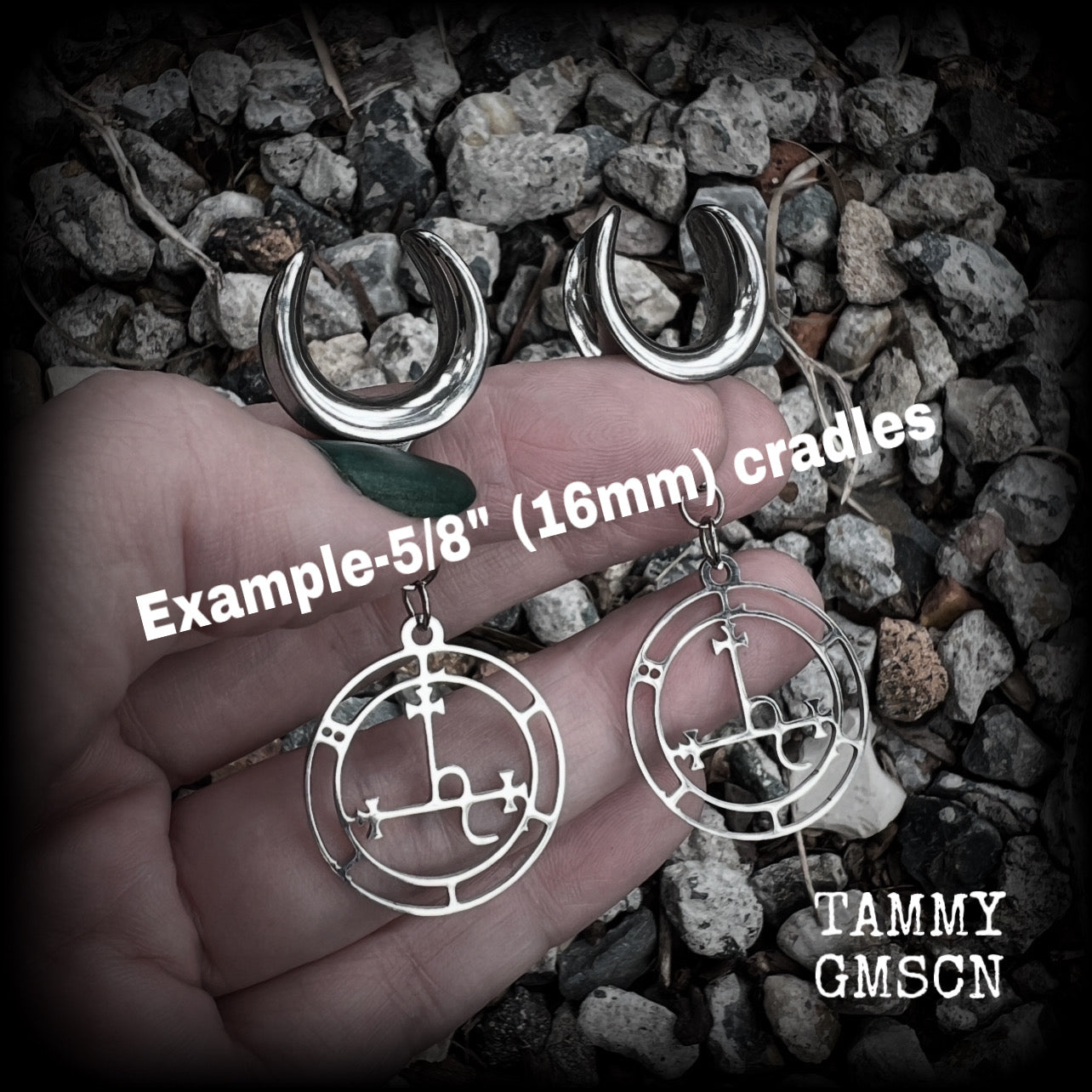 These gorgeous stainless steel earrings feature the Sigil of Lilith as it appears in The Lesser Key of Solomon, and are lovely and light weight, weighing only 5 grams each, and measure just under 6 cms from tip to tip.
This pair has been made on 5/8” gauge (16mm) surgical steel cradles, for stretched lobes.