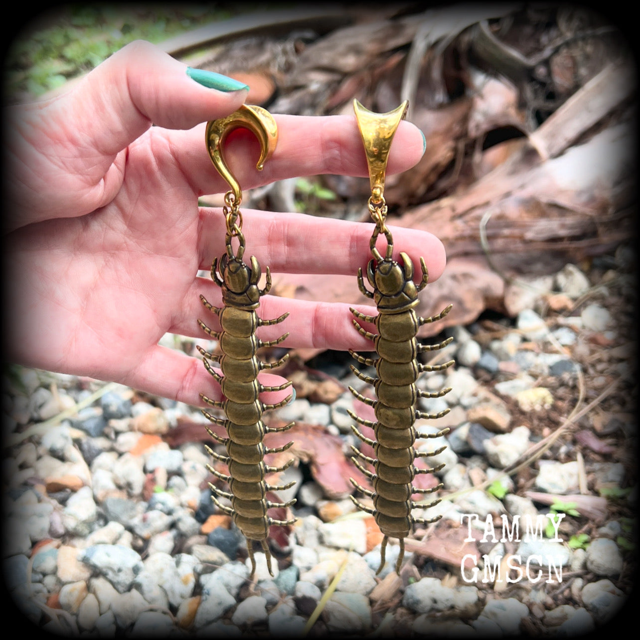 These awesome brass centipede ear hangers feature gorgeous brass invertebtrate pendants, measuring just over 17cms from tip to tip, and weighing approx 55 grams each, nice and dangly with a nice bit of weight.

This pair has been made on 5/8” gauge (16mm) titanium coated surgical steel saddles, suitable for stretched lobes.

