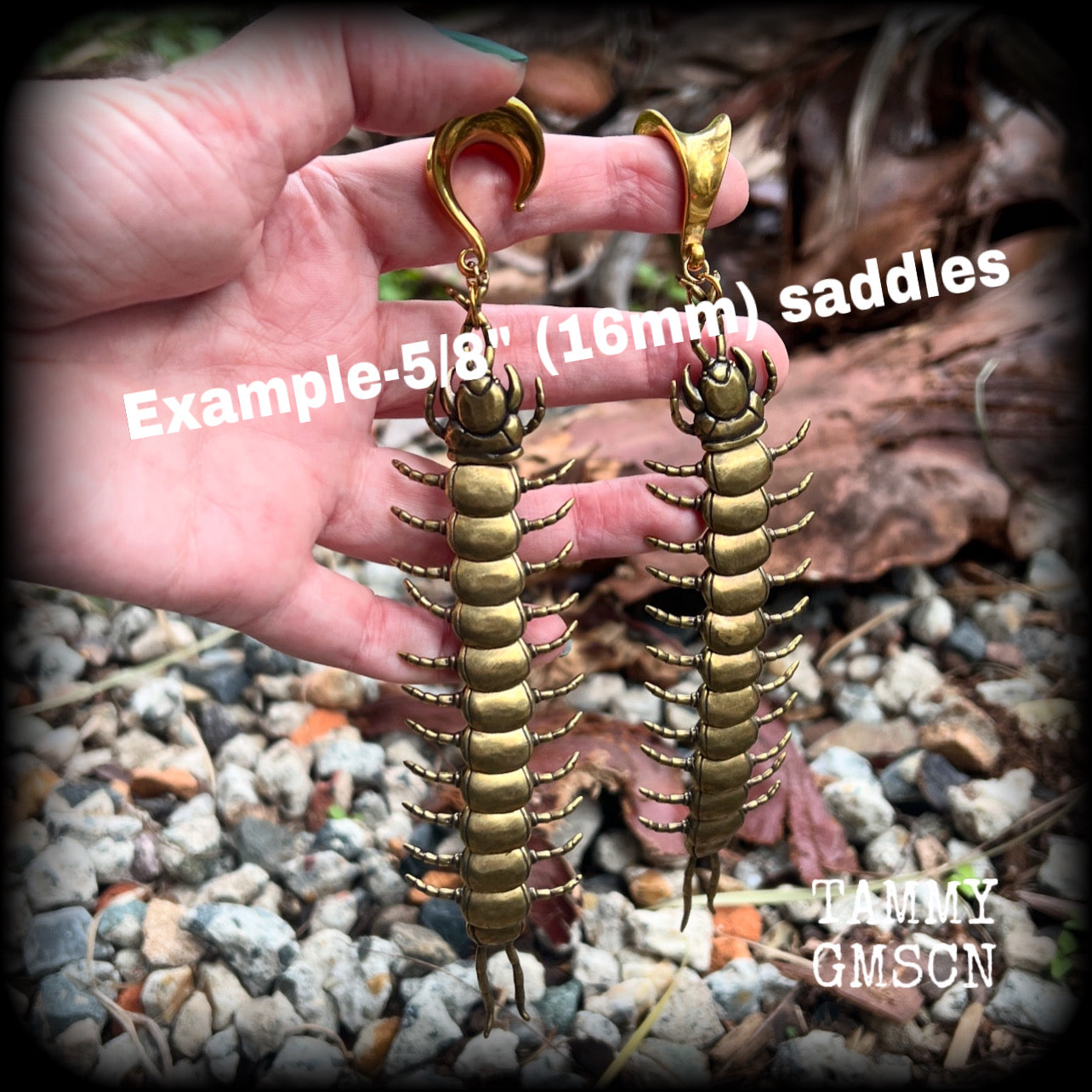 These awesome brass centipede ear hangers feature gorgeous brass invertebtrate pendants, measuring just over 17cms from tip to tip, and weighing approx 55 grams each, nice and dangly with a nice bit of weight.

This pair has been made on 5/8” gauge (16mm) titanium coated surgical steel saddles, suitable for stretched lobes.

