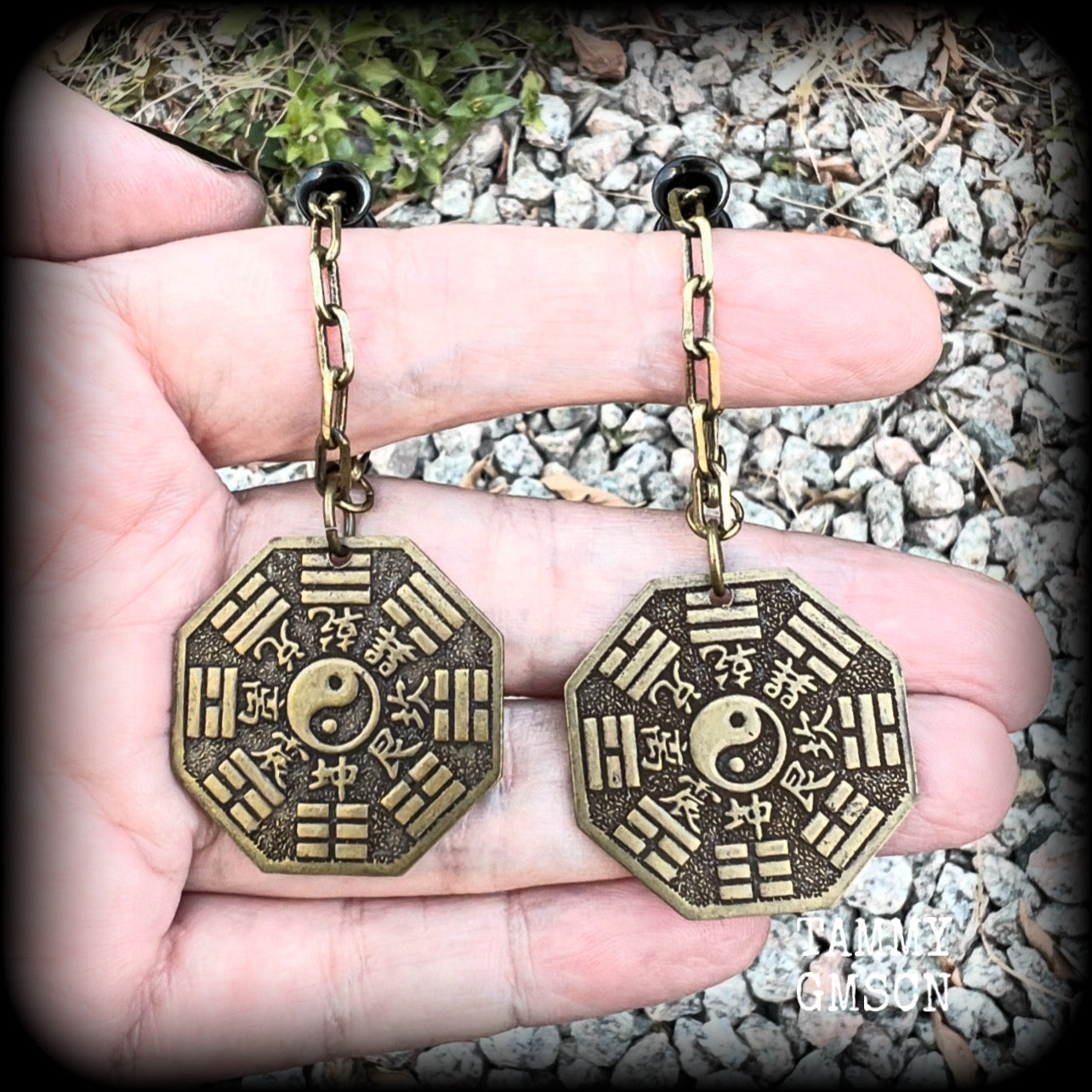 These unique tunnel dangles feature brass Tai Shang Lao Jun pendants, a type of Chinese Taoist pendant with the front side featuring the Chinese Bagua for protection, while the other side showcases a Chinese Taoism design for great protection.  🔥 These pendants are associated with Tai Shang Lao Jun, a prominent deity in Taoism, and are believed to offer protection and good fortune🔥  This pair weighs approx 10 grams each, and measuring 6.5cms from tip to tip.