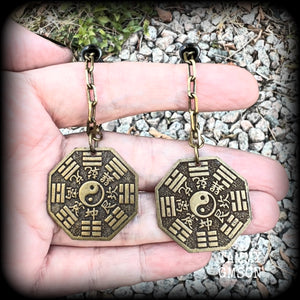 These unique tunnel dangles feature brass Tai Shang Lao Jun pendants, a type of Chinese Taoist pendant with the front side featuring the Chinese Bagua for protection, while the other side showcases a Chinese Taoism design for great protection.  🔥 These pendants are associated with Tai Shang Lao Jun, a prominent deity in Taoism, and are believed to offer protection and good fortune🔥  This pair weighs approx 10 grams each, and measuring 6.5cms from tip to tip.