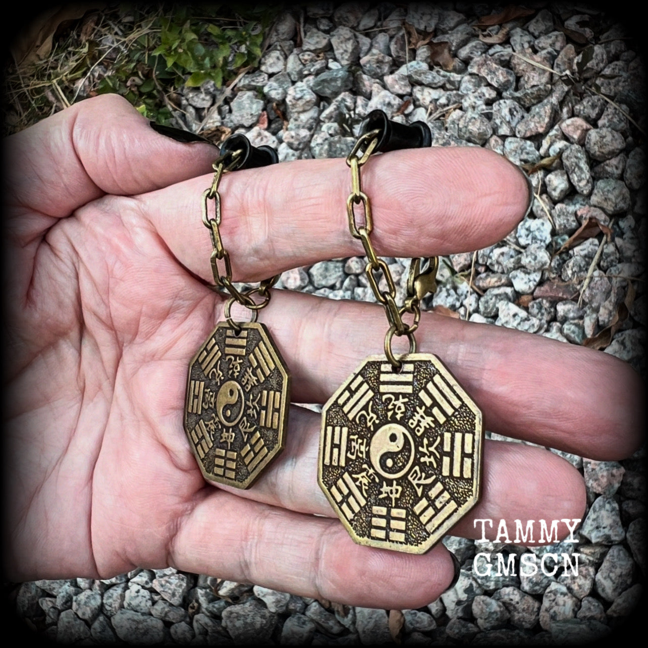 These unique tunnel dangles feature brass Tai Shang Lao Jun pendants, a type of Chinese Taoist pendant with the front side featuring the Chinese Bagua for protection, while the other side showcases a Chinese Taoism design for great protection.  🔥 These pendants are associated with Tai Shang Lao Jun, a prominent deity in Taoism, and are believed to offer protection and good fortune🔥  This pair weighs approx 10 grams each, and measuring 6.5cms from tip to tip.