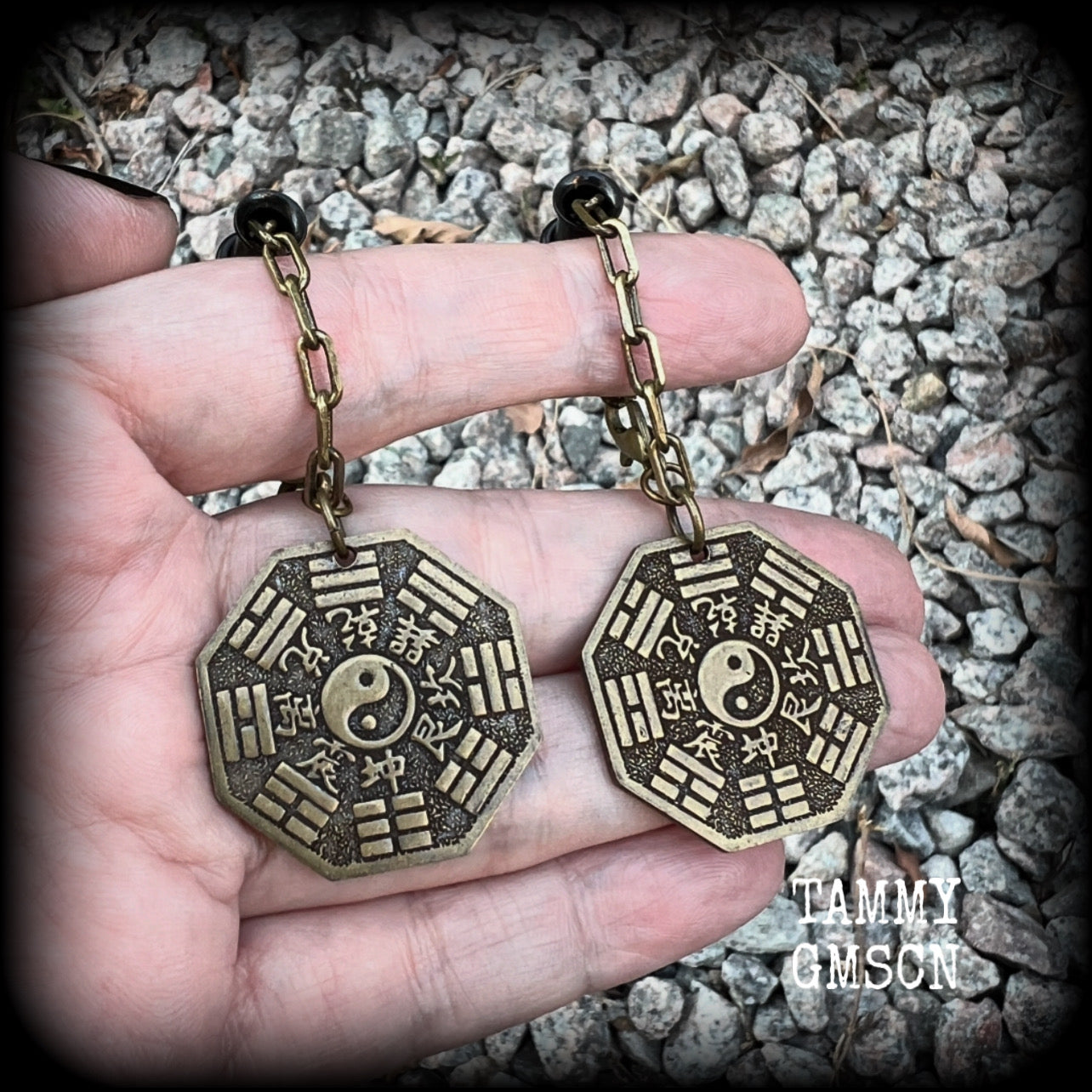 These unique tunnel dangles feature brass Tai Shang Lao Jun pendants, a type of Chinese Taoist pendant with the front side featuring the Chinese Bagua for protection, while the other side showcases a Chinese Taoism design for great protection.  🔥 These pendants are associated with Tai Shang Lao Jun, a prominent deity in Taoism, and are believed to offer protection and good fortune🔥  This pair weighs approx 10 grams each, and measuring 6.5cms from tip to tip.