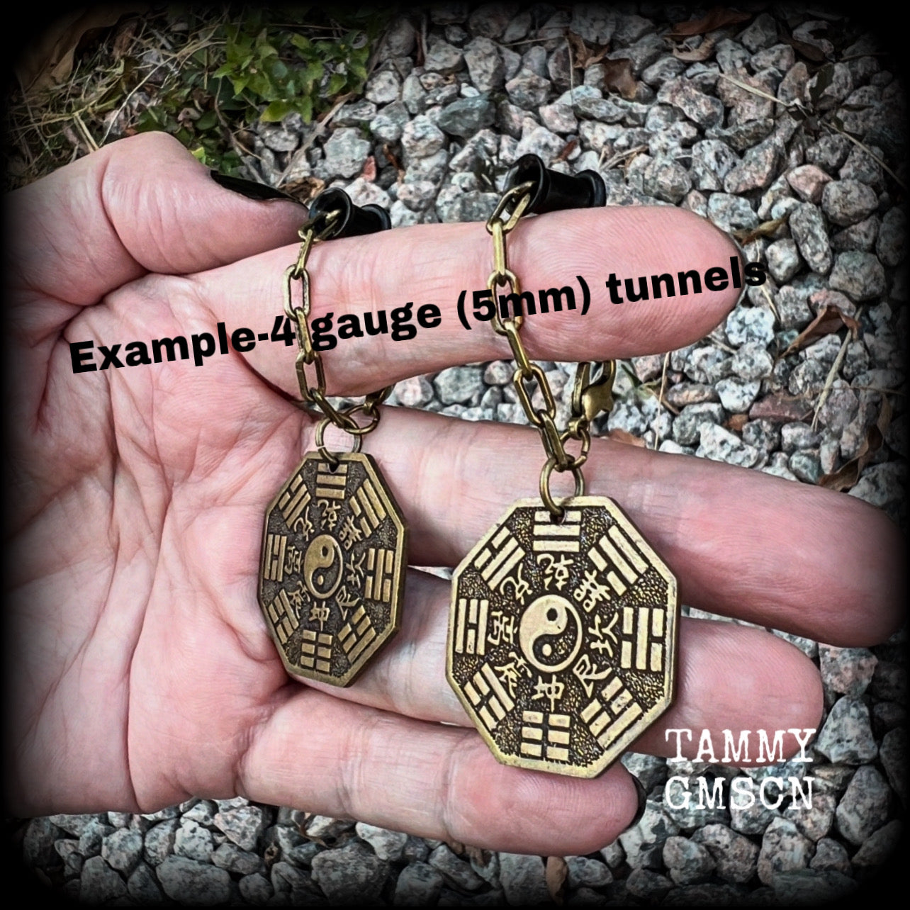 These unique tunnel dangles feature brass Tai Shang Lao Jun pendants, a type of Chinese Taoist pendant with the front side featuring the Chinese Bagua for protection, while the other side showcases a Chinese Taoism design for great protection.  🔥 These pendants are associated with Tai Shang Lao Jun, a prominent deity in Taoism, and are believed to offer protection and good fortune🔥  This pair weighs approx 10 grams each, and measuring 6.5cms from tip to tip.