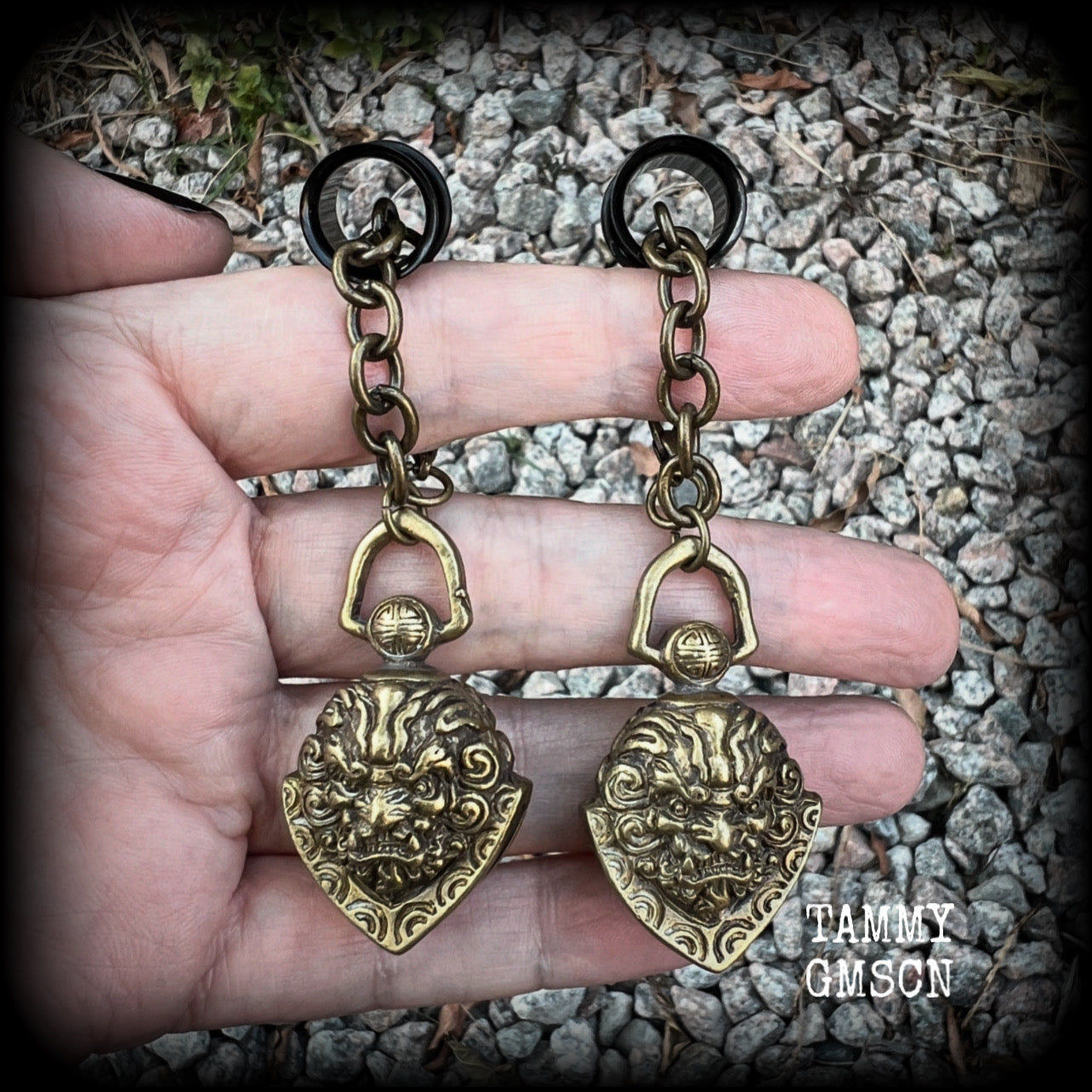 These unique tunnel dangles feature brass lion guardian bells, used in Tibetan Buddhism,  weighing approx 20 grams each, and measuring 8.5cms from tip to tip.  ✨ The ball inside the bell that rings has been disabled so these earrings wont make noise as you go about your day.