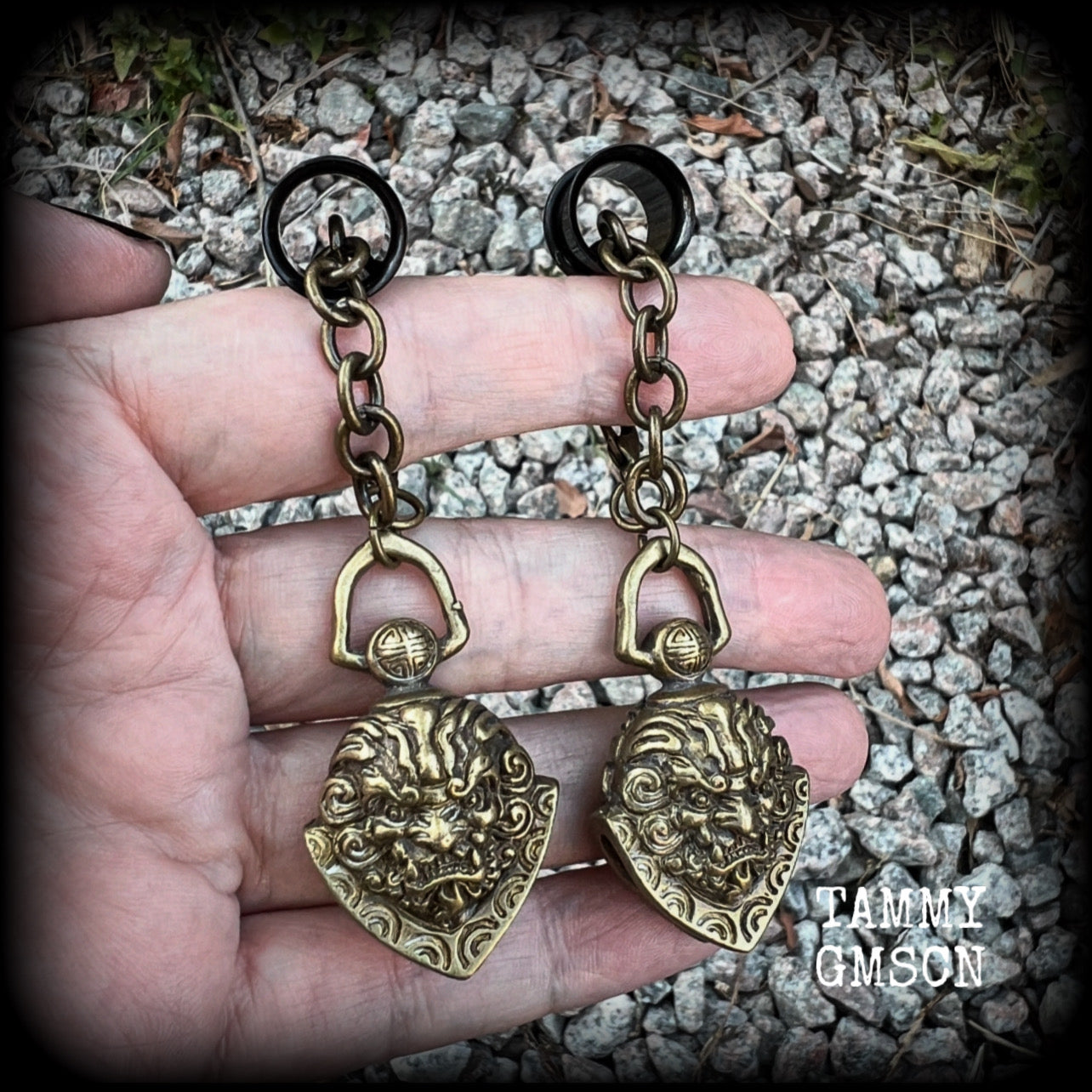 These unique tunnel dangles feature brass lion guardian bells, used in Tibetan Buddhism,  weighing approx 20 grams each, and measuring 8.5cms from tip to tip.  ✨ The ball inside the bell that rings has been disabled so these earrings wont make noise as you go about your day.