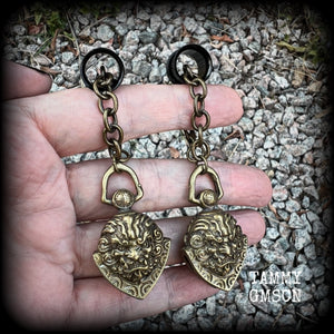These unique tunnel dangles feature brass lion guardian bells, used in Tibetan Buddhism,  weighing approx 20 grams each, and measuring 8.5cms from tip to tip.  ✨ The ball inside the bell that rings has been disabled so these earrings wont make noise as you go about your day.