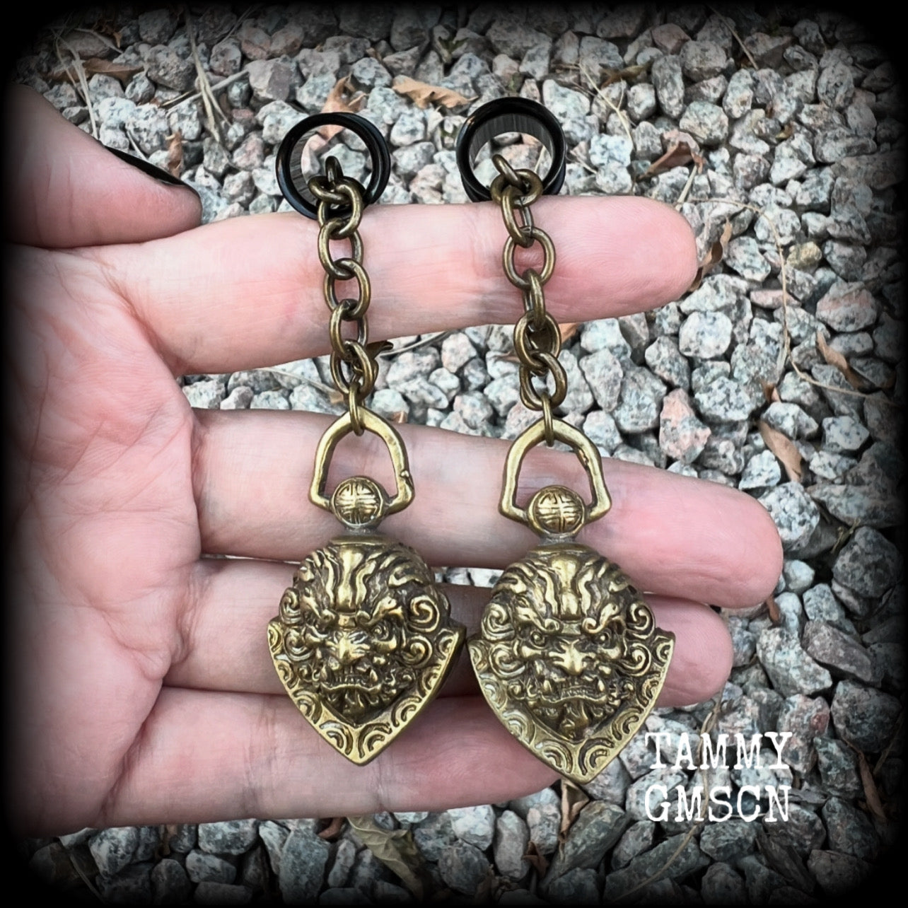 These unique tunnel dangles feature brass lion guardian bells, used in Tibetan Buddhism,  weighing approx 20 grams each, and measuring 8.5cms from tip to tip.  ✨ The ball inside the bell that rings has been disabled so these earrings wont make noise as you go about your day.