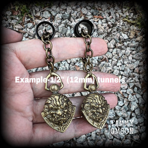 These unique tunnel dangles feature brass lion guardian bells, used in Tibetan Buddhism,  weighing approx 20 grams each, and measuring 8.5cms from tip to tip.  ✨ The ball inside the bell that rings has been disabled so these earrings wont make noise as you go about your day.