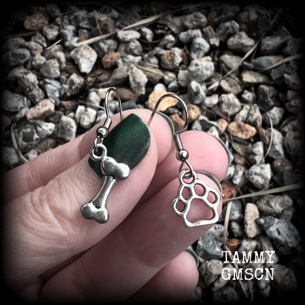 These adorable earrings feature cute classic antique silver dog bone and paw print charms, measuring just under 3cms from tip to tip, and weighing only a gram or two each.

This pair has been made with stainless steel french hooks, suitable for pierced ears.