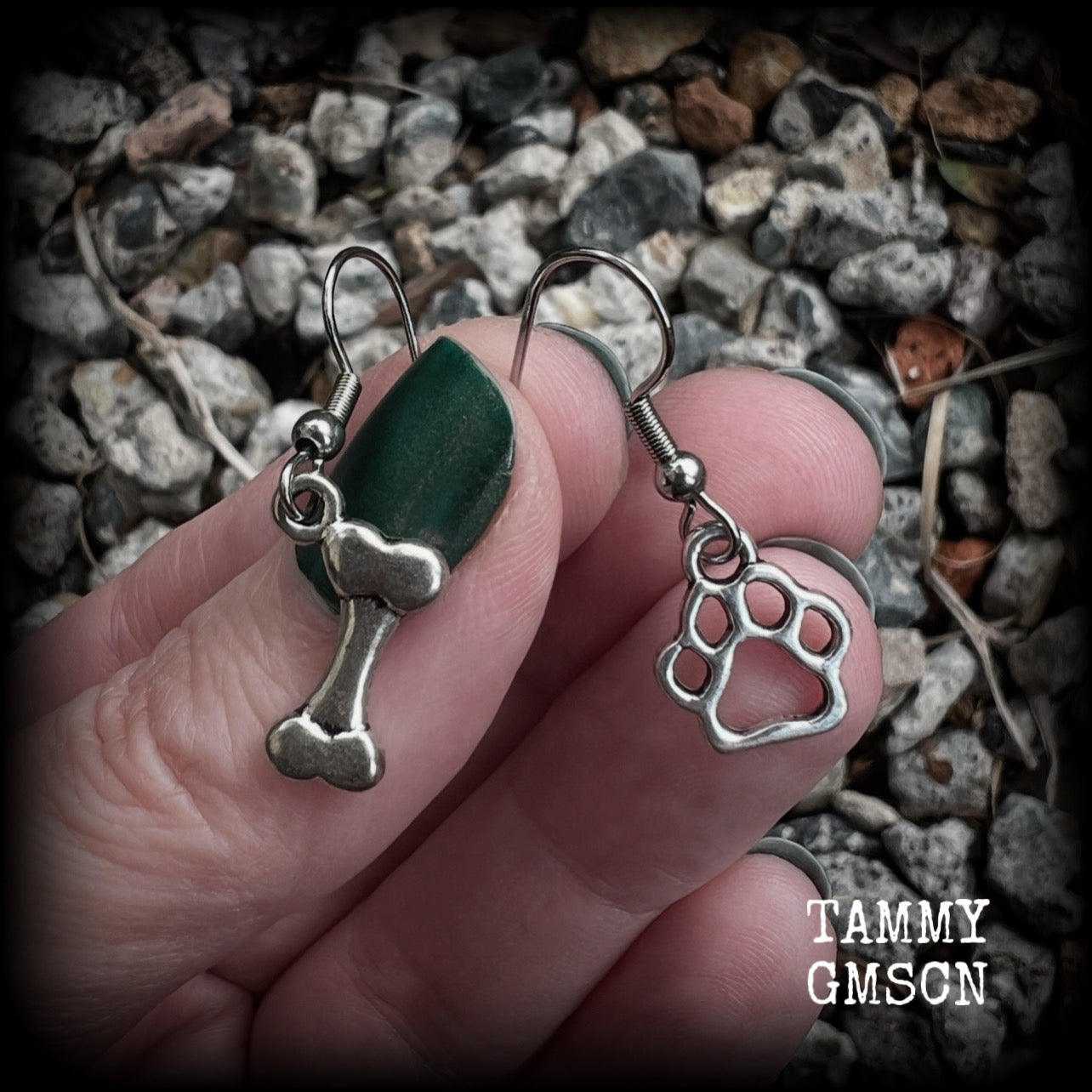 These adorable earrings feature cute classic antique silver dog bone and paw print charms, measuring just under 3cms from tip to tip, and weighing only a gram or two each.

This pair has been made with stainless steel french hooks, suitable for pierced ears.