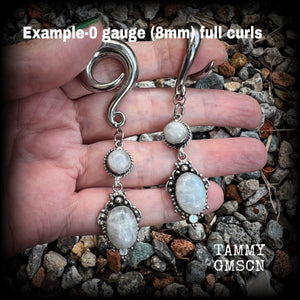 These beautiful boho Rainbow moonstone earrings are made with gorgeous polished gemstones, lovely and dangly measuring approx 8.5cms from tip to tip, and weighing approx 19 grams each.  These earrings have been made on 0 gauge (8mm) surgical steel full curl hooks, to be worn in stretched lobes.