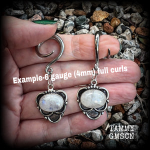 This pair of Rainbow moonstone gauged earrings feature gorgeous polished gemstones in a beautiful boho antique silver setting, lovely and dangly measuring approx 5.5cms from tip to tip, and weighing approx 7 grams each.