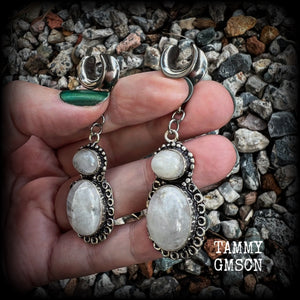 This pair of Rainbow moonstone gauged earrings feature gorgeous polished gemstones in a beautiful boho antique silver setting, lovely and dangly measuring 6.5cms from tip to tip, and weighing approx 10 grams each.  These earrings have been made on 00 gauge (10mm) surgical steel cradles, to be worn in stretched lobes.