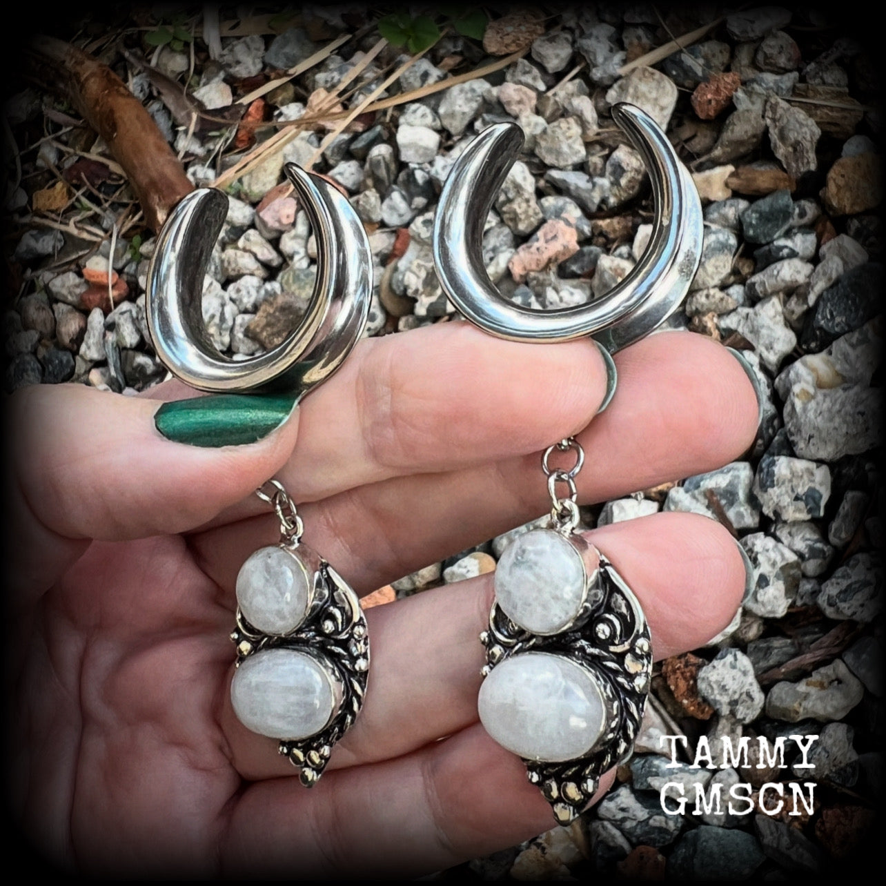 This pair of Rainbow moonstone gauged earrings feature gorgeous polished gemstones in a beautiful boho antique silver setting, lovely and dangly measuring just on 8cms from tip to tip, and weighing approx 14 grams each.  These earrings have been made on 1“ gauge (25mm) surgical steel cradles, to be worn in stretched lobes.