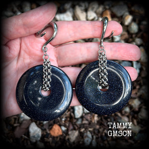 This pair of gorgeous gauged earrings features a pair of sparkly midnight blue sandstone donut gemstones cradled in stainless steel chain, measuring just over 9cms from tip to tip, and weighing approx 34 grams each.

This pair have been made on 2 gauge (6mm) surgical steel full curls, to be worn in stretched lobes.