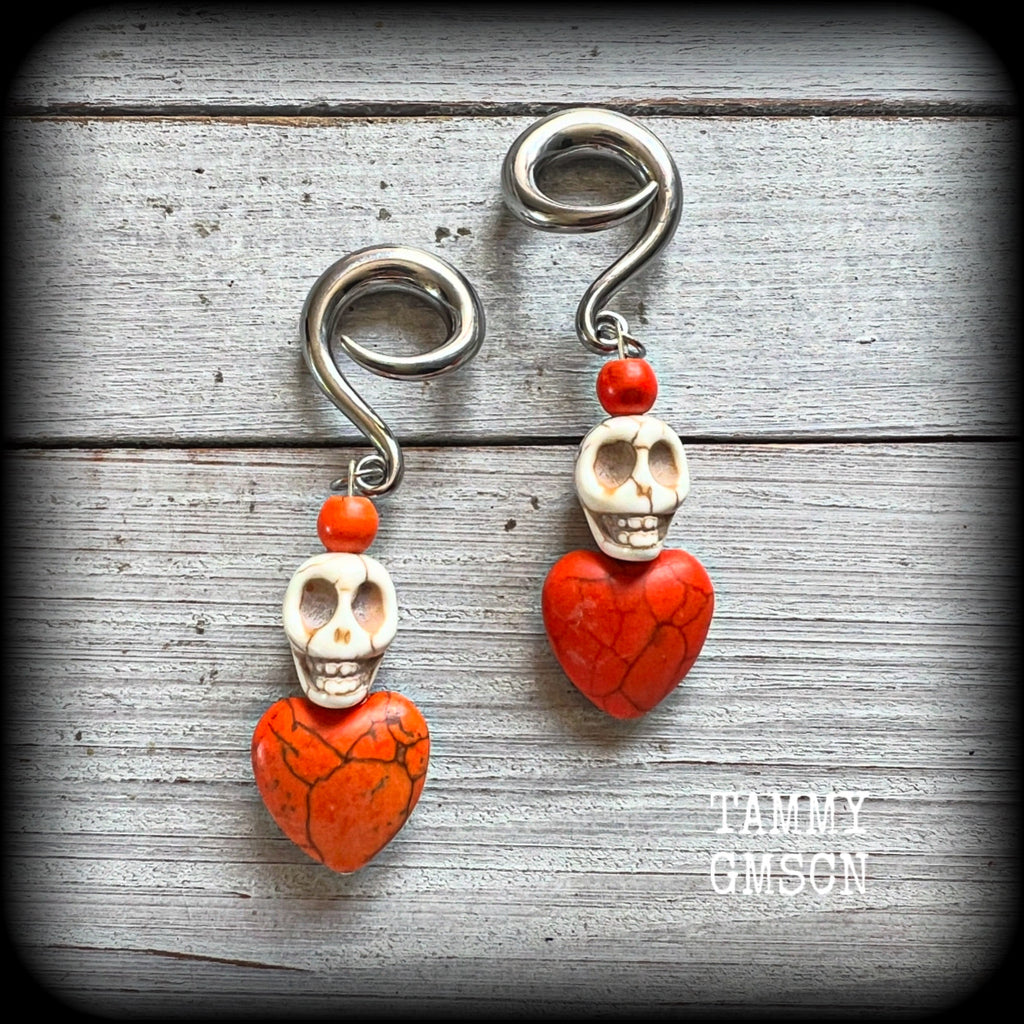 Featuring bone white stone skulls sitting atop pumpkin spice hearts, these earrings have been made especially for Day of the Dead celebrations!

These gorgeous earrings are nice and light weight at 13 grams a piece, and nice and dangly at just on 7.5cms from tip to tip.

This pair of beautiful gauged earrings has been made with 2 gauge (6mm) surgical steel full curl hooks, suitable for stretched lobes.