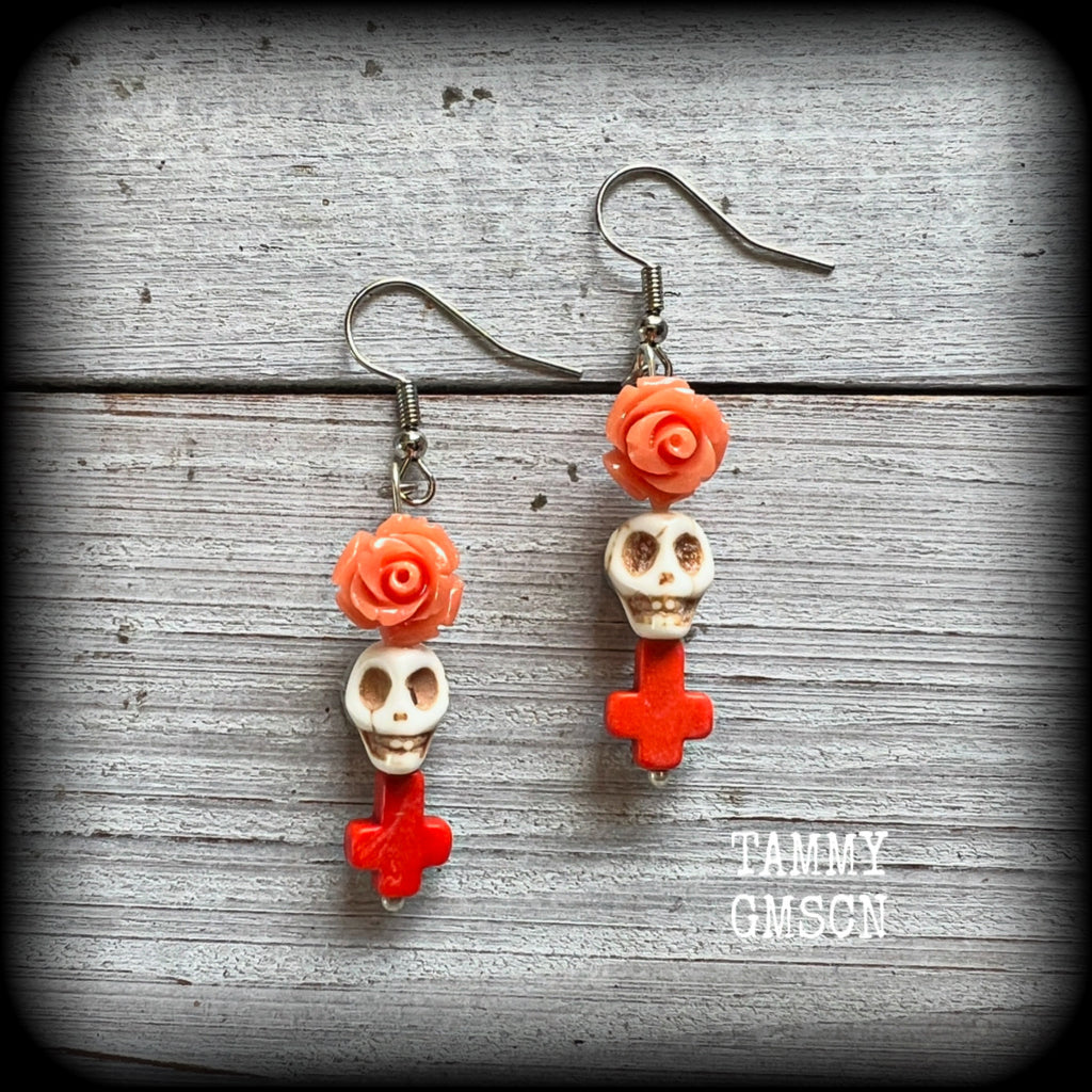 This pair of beautiful earrings features gorgeous pumpkin spice coloured roses and crosses with bone white howlite stone skulls.
Measuring just under 6cms from tip to tip and weighing only a gram or two each, these are lovely and lightweight, and nice and dangly.

This pair have been made with stainless steel french hooks, for pierced ears.