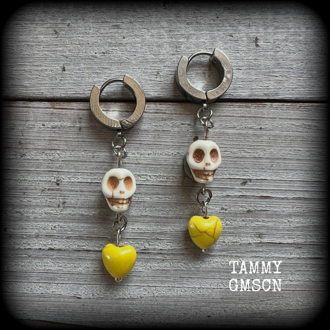 This pair of beautiful earrings features gorgeous canary yellow hearts dangling from bone white howlite stone skulls.
Measuring just over 5cms from tip to tip and weighing only a gram or two each, these are lovely and lightweight, and nice and dangly.