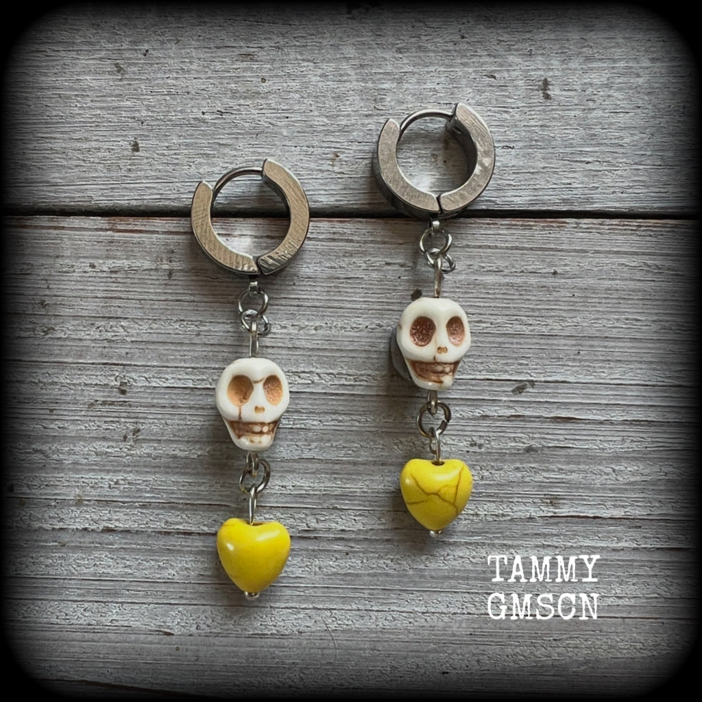 This pair of beautiful earrings features gorgeous canary yellow hearts dangling from bone white howlite stone skulls.
Measuring just over 5cms from tip to tip and weighing only a gram or two each, these are lovely and lightweight, and nice and dangly.