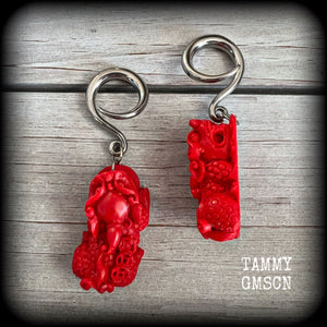 These gorgeous earrings feature stunning deep red Cinnabar Pi Xui lions, measuring just over 6cms from tip to tip, and weighing approx 9 grams each.

This pair has been made with 6 gauge (4mm) surgical steel full curl hooks, suitable for stretched lobes.
