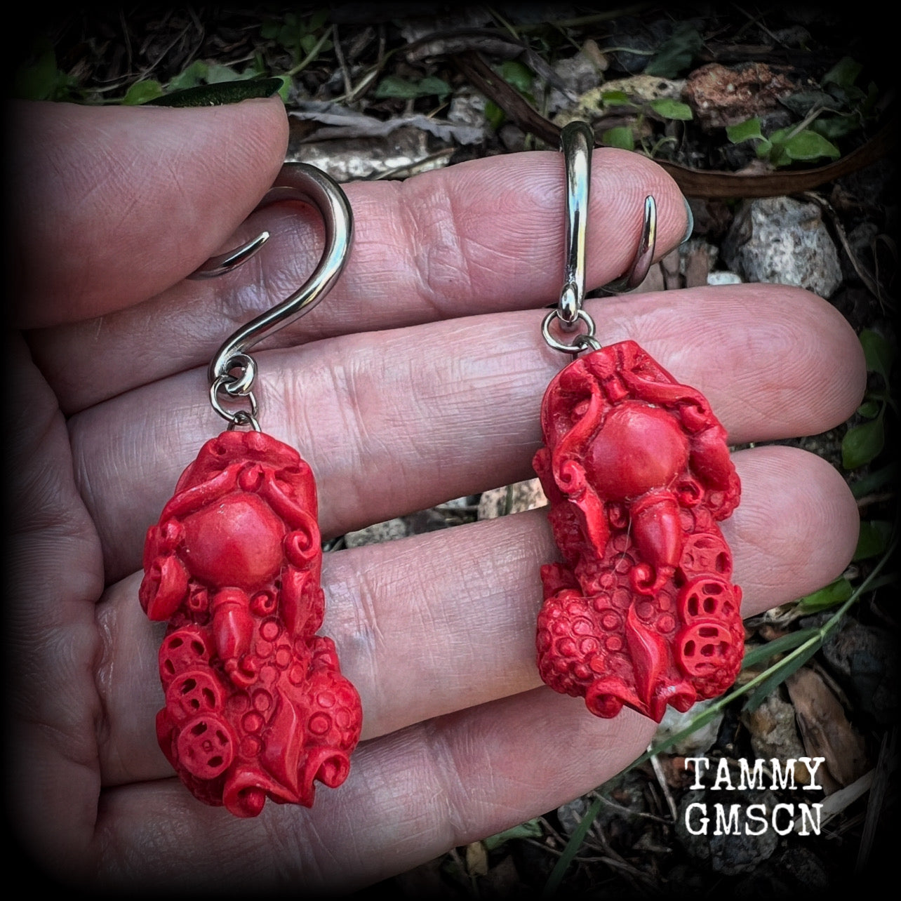 These gorgeous earrings feature stunning deep red Cinnabar Pi Xui lions, measuring just over 6cms from tip to tip, and weighing approx 9 grams each.

This pair has been made with 6 gauge (4mm) surgical steel full curl hooks, suitable for stretched lobes.
