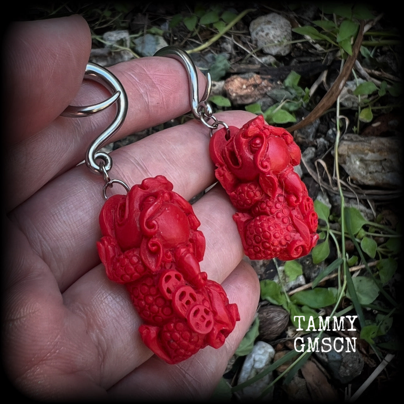 These gorgeous earrings feature stunning deep red Cinnabar Pi Xui lions, measuring just over 6cms from tip to tip, and weighing approx 9 grams each.

This pair has been made with 6 gauge (4mm) surgical steel full curl hooks, suitable for stretched lobes.
