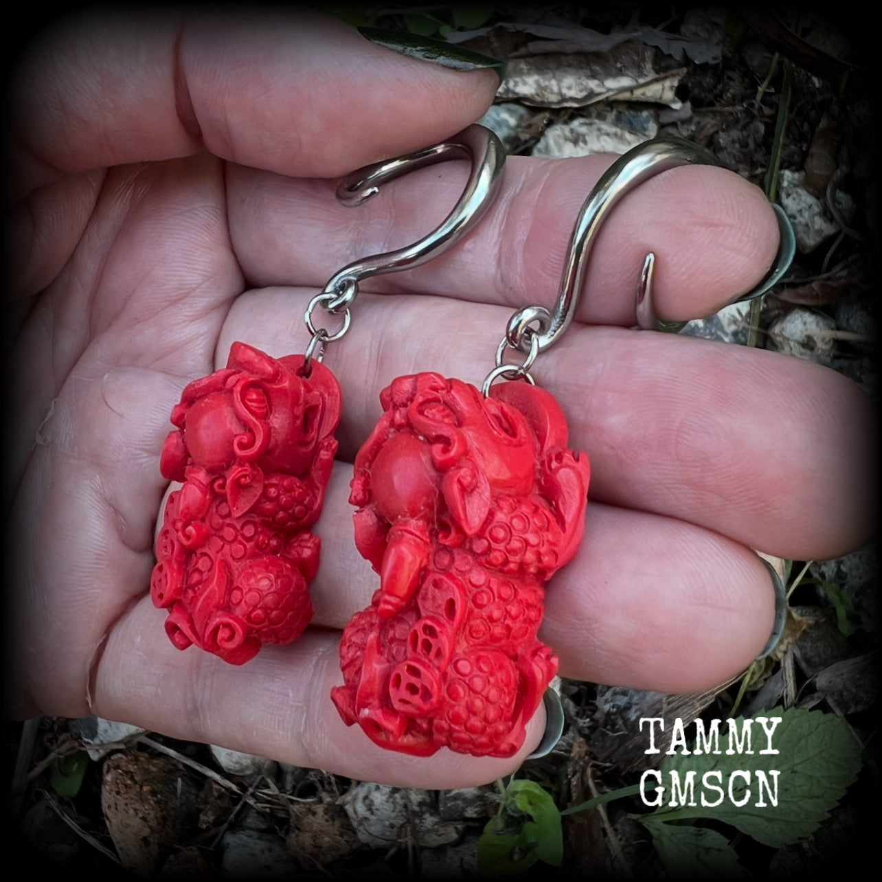 These gorgeous earrings feature stunning deep red Cinnabar Pi Xui lions, measuring just over 6cms from tip to tip, and weighing approx 9 grams each.

This pair has been made with 6 gauge (4mm) surgical steel full curl hooks, suitable for stretched lobes.

