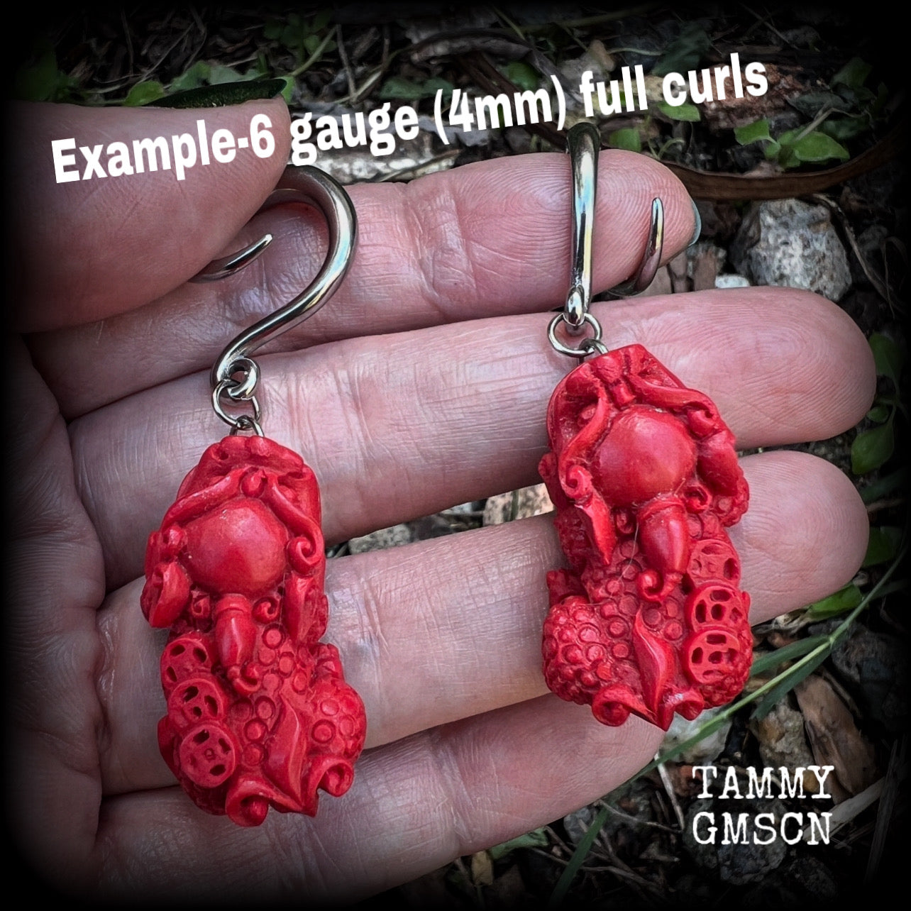 These gorgeous earrings feature stunning deep red Cinnabar Pi Xui lions, measuring just over 6cms from tip to tip, and weighing approx 9 grams each.

This pair has been made with 6 gauge (4mm) surgical steel full curl hooks, suitable for stretched lobes.
