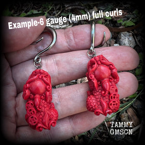 These gorgeous earrings feature stunning deep red Cinnabar Pi Xui lions, measuring just over 6cms from tip to tip, and weighing approx 9 grams each.

This pair has been made with 6 gauge (4mm) surgical steel full curl hooks, suitable for stretched lobes.
