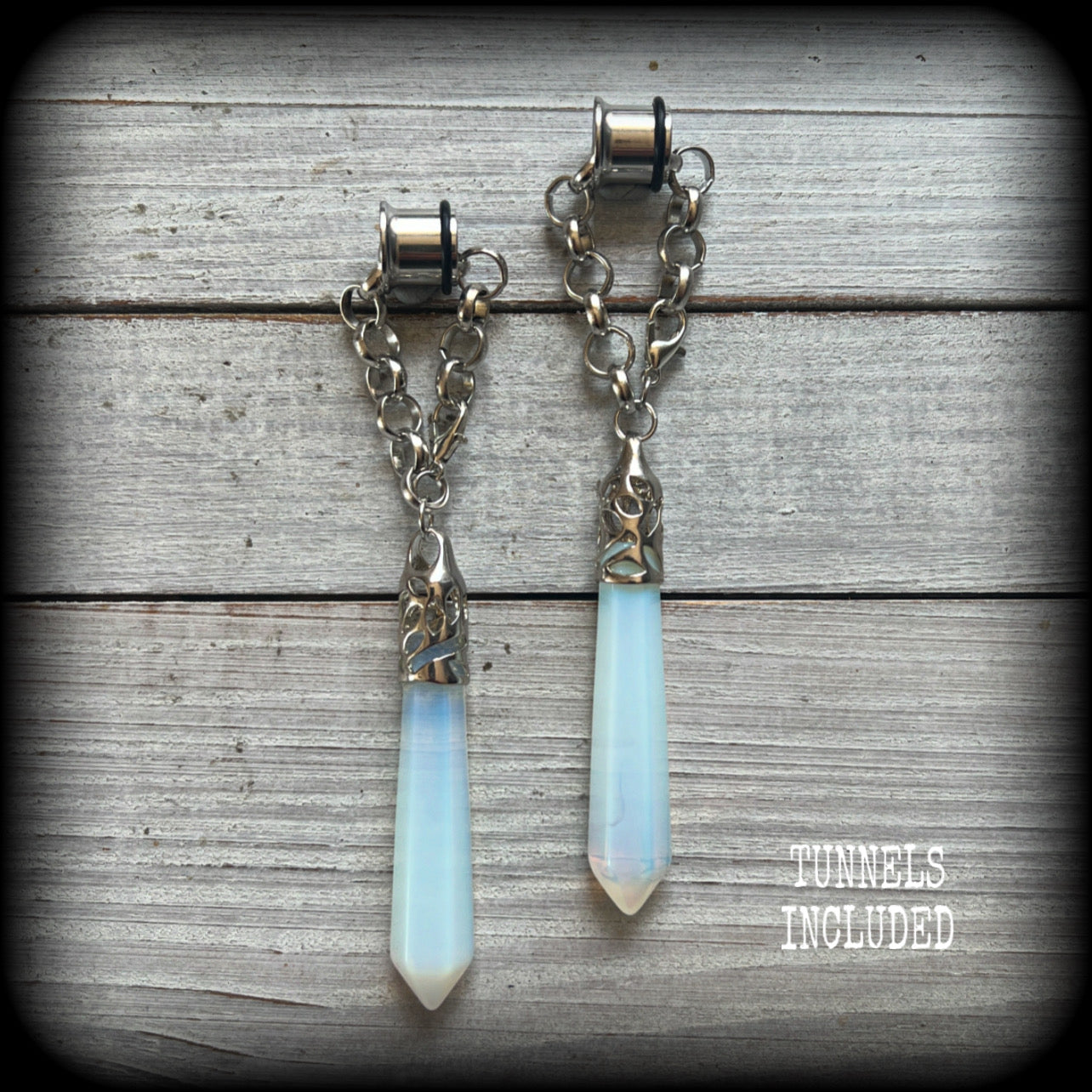 These gorgeous opalite earrings have been made with transluscent gemstone points, are nice and dangly measuring in at approx 10.5cms from tip to tip and not too heavy at 15 grams a piece. 
