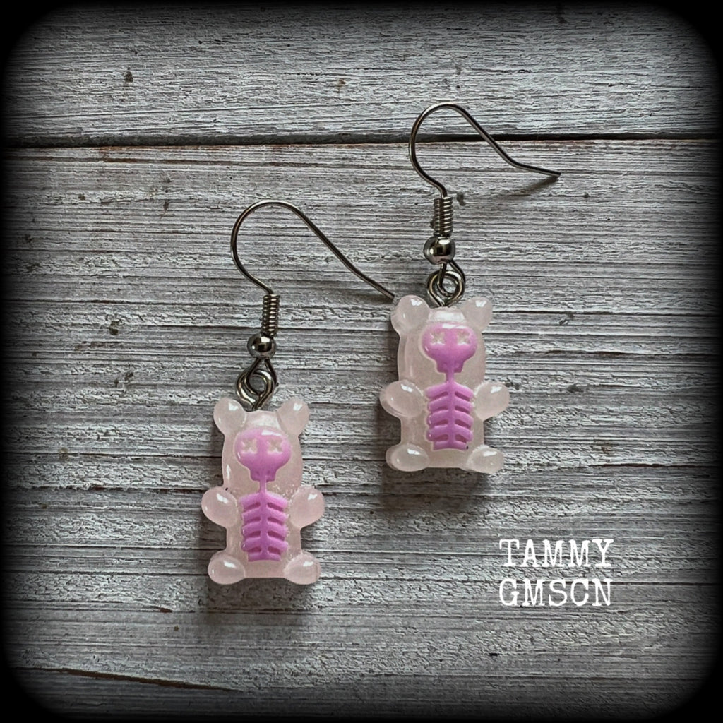 Featuring spooky cute pink skeleton gummy bears, these adorable earrings measure just on 5cms from tip to tip and are super light weight, weighing only a gram or two each.

This pair has been made with stainless steel french hooks, to be worn in pierced ears.