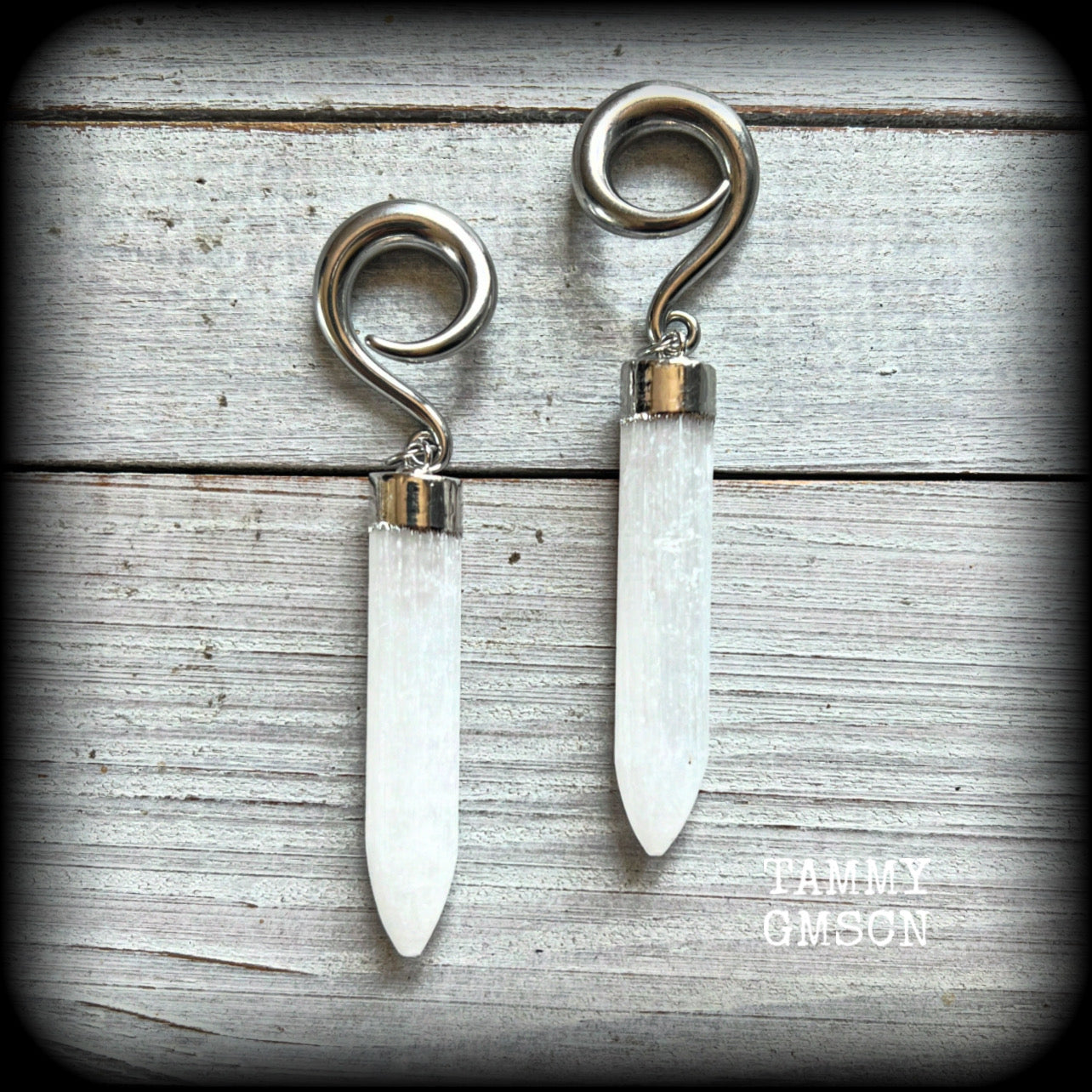 These beautiful gauged earrings feature gorgeous selenite points, measuring just over 9cms from tip to tip, and weighing approx 17 grams each.

This pair have been made on 2 gauge (6mm) surgical steel full curl hooks, to be worn in stretched lobes.