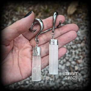These beautiful gauged earrings feature gorgeous selenite pieces, measuring just over 9cms from tip to tip, and weighing approx 22 grams each.

This pair have been made on 0 gauge (8mm) surgical steel full curl hooks, to be worn in stretched lobes.

