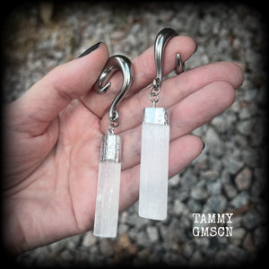 These beautiful gauged earrings feature gorgeous selenite pieces, measuring just over 9cms from tip to tip, and weighing approx 22 grams each.

This pair have been made on 0 gauge (8mm) surgical steel full curl hooks, to be worn in stretched lobes.
