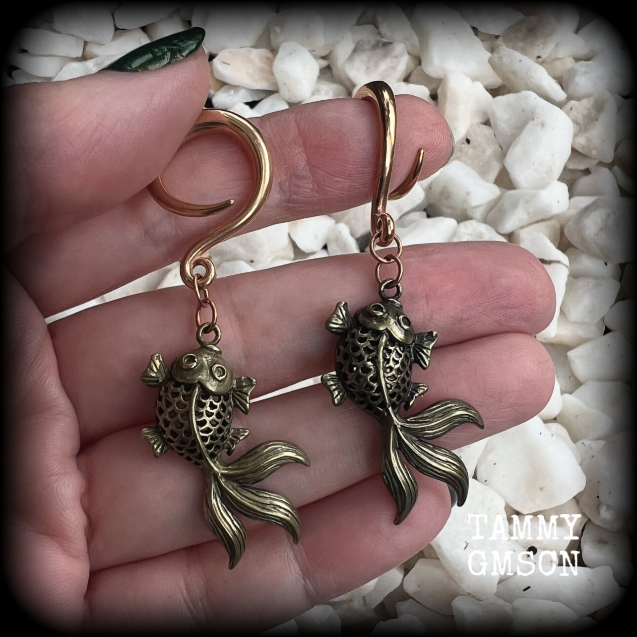These gorgeous earrings feature antique bronze koi fish, super lightweight at approx. 6 grams each and measuring approx 6.5cms from tip to tip.

This pair have been made on 6 gauge (4mm) surgical steel full curls, suitable for stretched lobes.