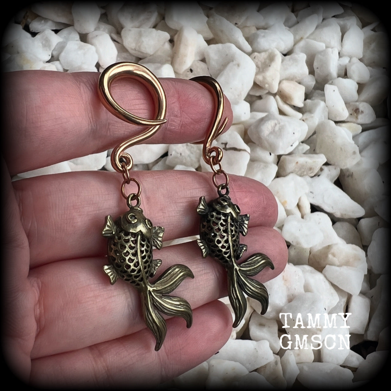 These gorgeous earrings feature antique bronze koi fish, super lightweight at approx. 6 grams each and measuring approx 6.5cms from tip to tip.

This pair have been made on 6 gauge (4mm) surgical steel full curls, suitable for stretched lobes.