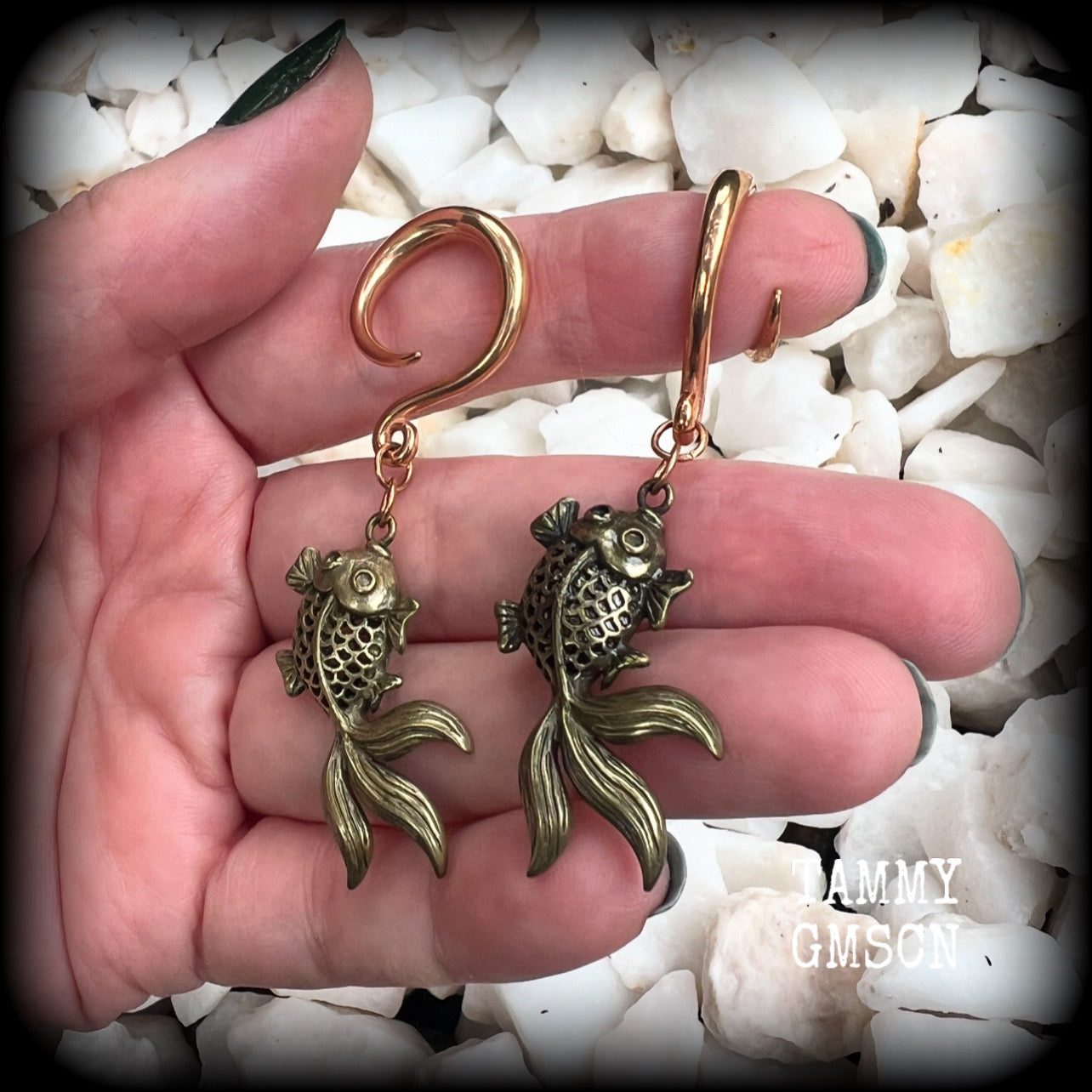 These gorgeous earrings feature antique bronze koi fish, super lightweight at approx. 6 grams each and measuring approx 6.5cms from tip to tip.

This pair have been made on 6 gauge (4mm) surgical steel full curls, suitable for stretched lobes.
