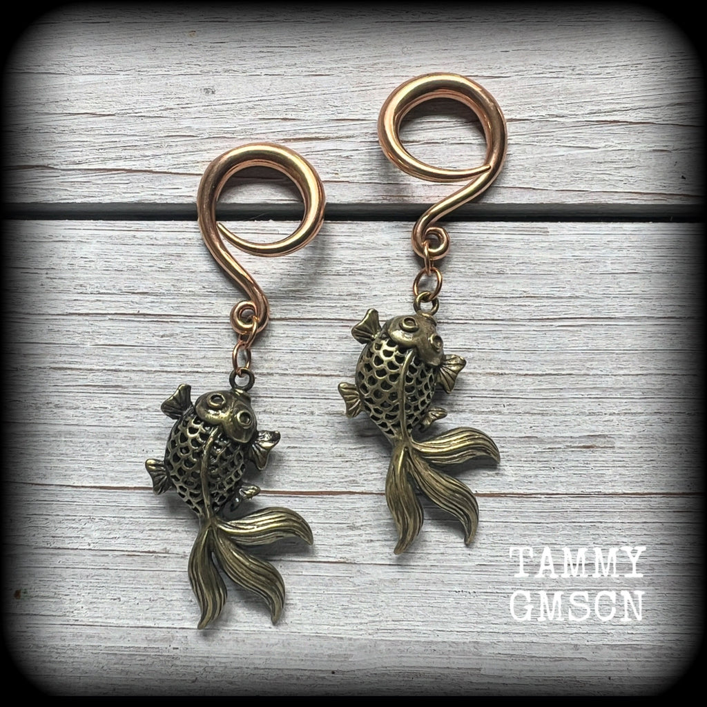 These gorgeous earrings feature antique bronze koi fish, super lightweight at approx. 6 grams each and measuring approx 6.5cms from tip to tip.

This pair have been made on 6 gauge (4mm) surgical steel full curls, suitable for stretched lobes.