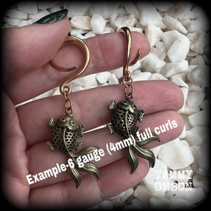 These gorgeous earrings feature antique bronze koi fish, super lightweight at approx. 6 grams each and measuring approx 6.5cms from tip to tip.

This pair have been made on 6 gauge (4mm) surgical steel full curls, suitable for stretched lobes.