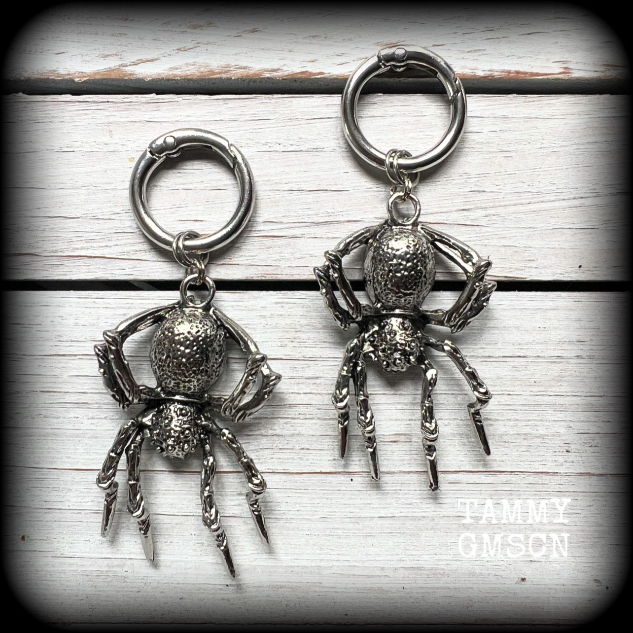 These gorgeous dangly earrings feature big antique silver spiders, measuring approx 9 cms from tip to tip, and weighing approx 24 grams a piece .

These earrings have been made on strong silver alloy snap hoop rings, to be worn in stretched lobes with silicone earlets from 2 gauge (6mm).