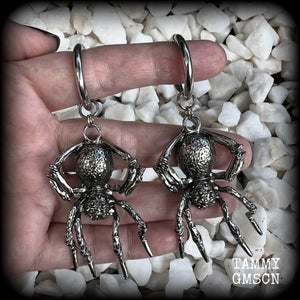 These gorgeous dangly earrings feature big antique silver spiders, measuring approx 9 cms from tip to tip, and weighing approx 24 grams a piece . 

These earrings have been made on strong silver alloy snap hoop rings, to be worn in stretched lobes with silicone earlets from 2 gauge (6mm).

