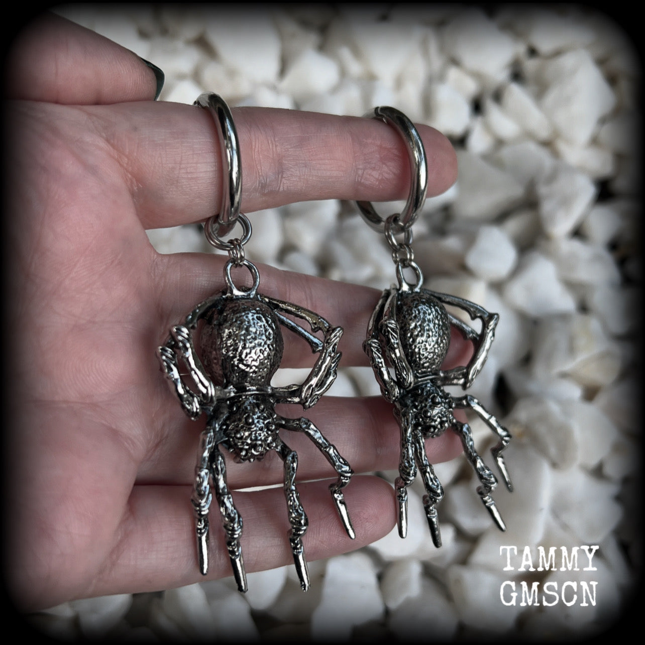 These gorgeous dangly earrings feature big antique silver spiders, measuring approx 9 cms from tip to tip, and weighing approx 24 grams a piece . 

These earrings have been made on strong silver alloy snap hoop rings, to be worn in stretched lobes with silicone earlets from 2 gauge (6mm).
