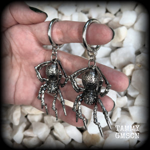 These gorgeous dangly earrings feature big antique silver spiders, measuring approx 9 cms from tip to tip, and weighing approx 24 grams a piece . 

These earrings have been made on strong silver alloy snap hoop rings, to be worn in stretched lobes with silicone earlets from 2 gauge (6mm).
