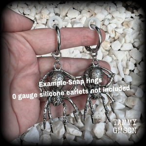 These gorgeous dangly earrings feature big antique silver spiders, measuring approx 9 cms from tip to tip, and weighing approx 24 grams a piece . 

These earrings have been made on strong silver alloy snap hoop rings, to be worn in stretched lobes with silicone earlets from 2 gauge (6mm).
