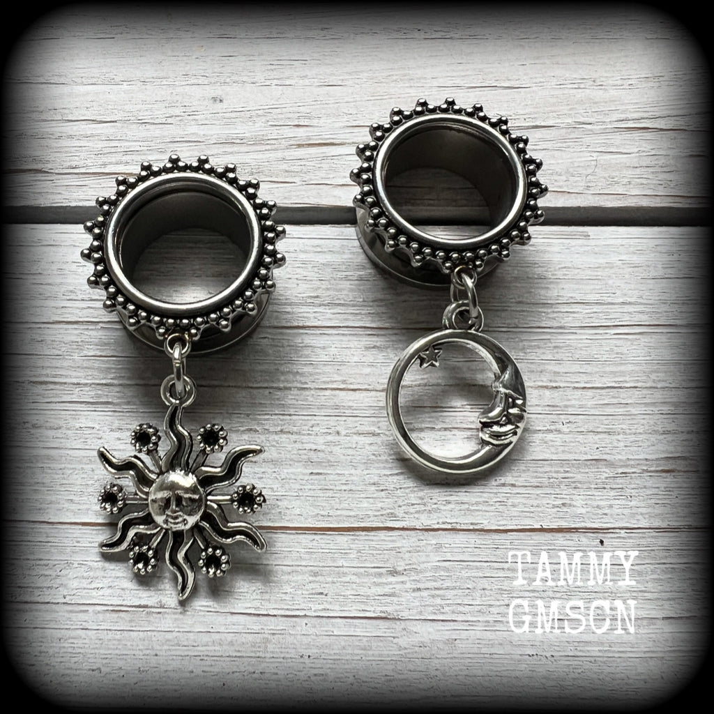 These gorgeous tunnels feature folk horror inspired antique silver crescent moon and esoteric sun charms, are super light weight at just 5 grams each and measure just over 4.5 cms from tip to tip.

This pair has been made with 5/8” gauge (16mm) ornate surgical steel screw fit tunnels-for stretched lobes.