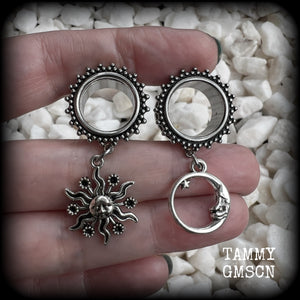 These gorgeous tunnels feature folk horror inspired antique silver crescent moon and esoteric sun charms, are super light weight at just 5 grams each and measure just over 4.5 cms from tip to tip.

This pair has been made with 5/8” gauge (16mm) ornate surgical steel screw fit tunnels-for stretched lobes.