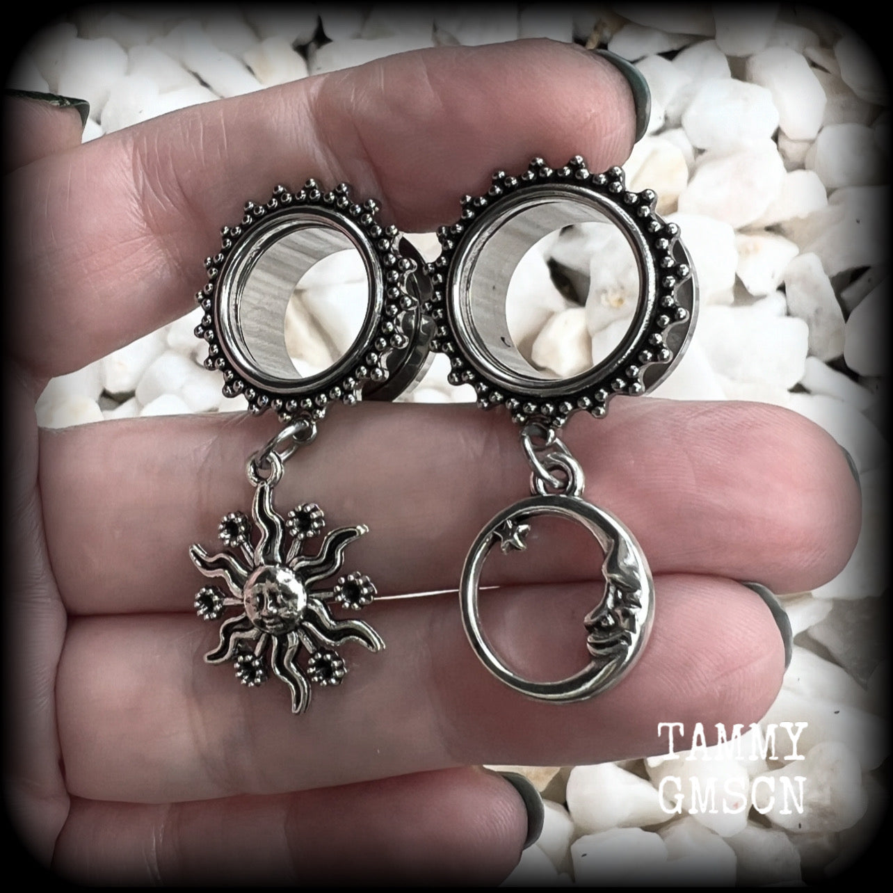 These gorgeous tunnels feature folk horror inspired antique silver crescent moon and esoteric sun charms, are super light weight at just 5 grams each and measure just over 4.5 cms from tip to tip.

This pair has been made with 5/8” gauge (16mm) ornate surgical steel screw fit tunnels-for stretched lobes.