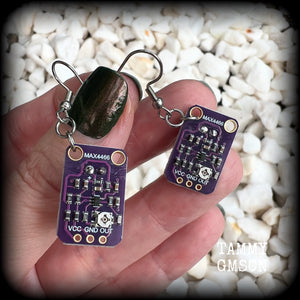 These awesome dark purple circuit board earrings measure just on 5.5cms from tip to tip, and weigh only a few grams each, these are lovely and lightweight and not too dangly.

This pair has been made on stainless steel french hooks, to be worn in pierced ears.