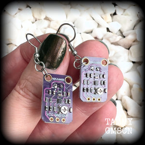 These awesome dark purple circuit board earrings measure just on 5.5cms from tip to tip, and weigh only a few grams each, these are lovely and lightweight and not too dangly.

This pair has been made on stainless steel french hooks, to be worn in pierced ears.